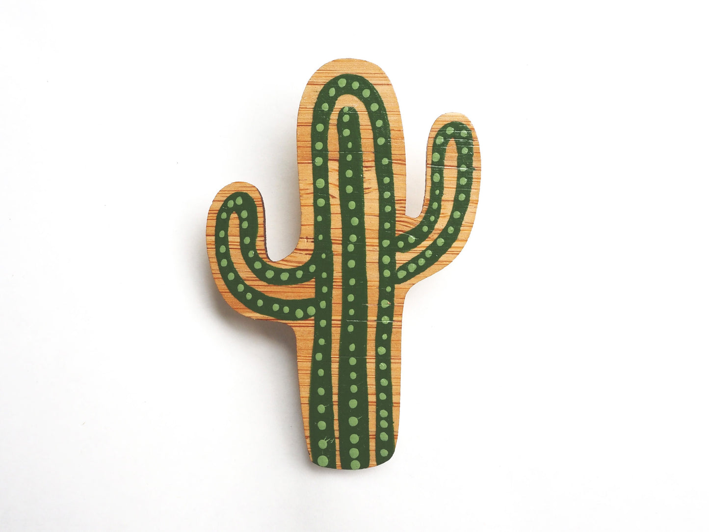 Laser cut hand painted wooden brooch in a cactus shape.