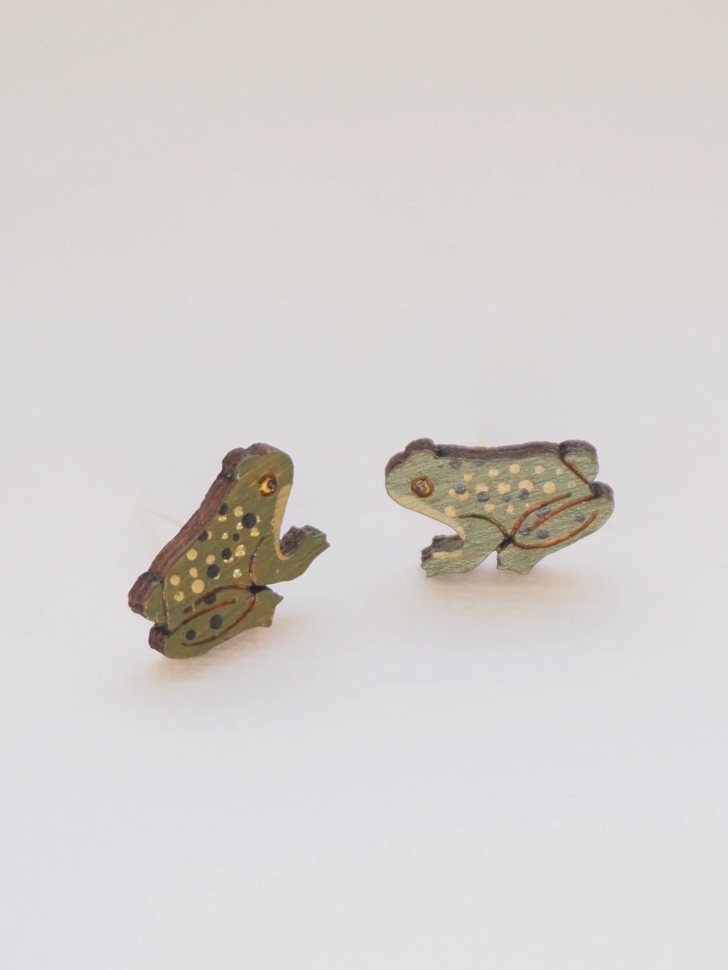 Hand Painted Frog Earrings made from bamboo, featuring earthy colors and charming frog designs.
