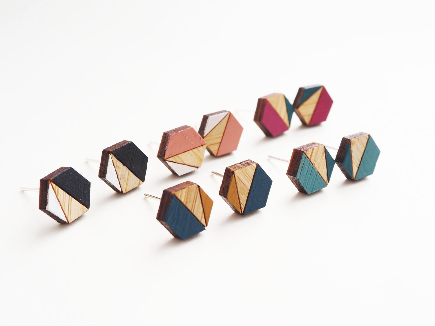 bamboo hexagon shaped earrings, laser cut and hand painted in a geometric design.